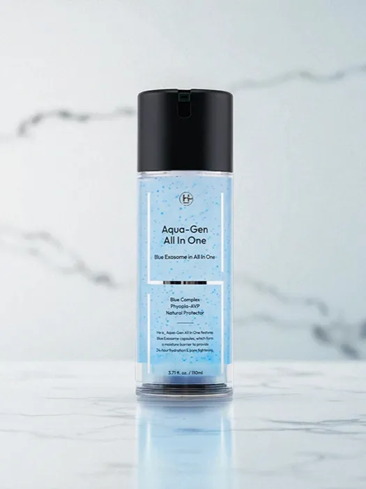 He Is Korean moisturizer for men in a blue translucent bottle with black cap, displayed on a marble surface