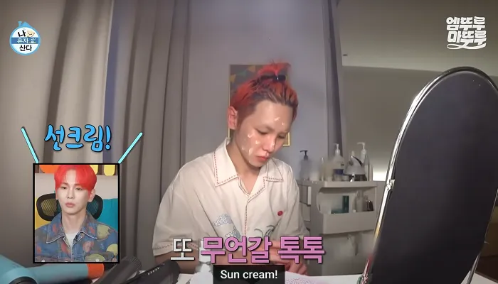 Key putting on sunscreen in an episode of I Live Alone