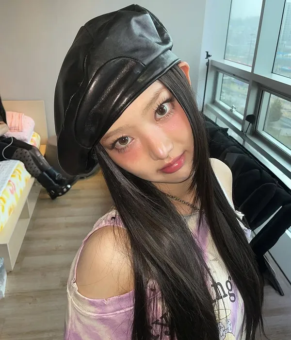 K-pop idol with Y2K-inspired cheek makeup applied across the midface section