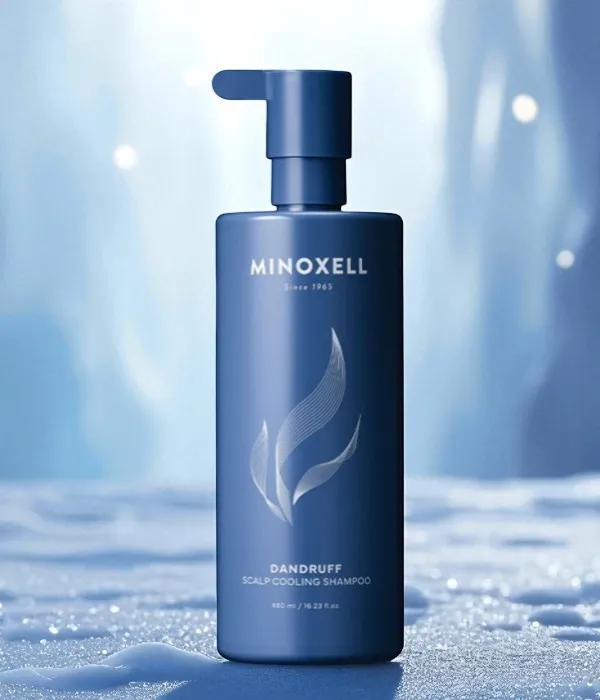 Minoxell Dandruff Scalp Cooling Shampoo displayed in a frosty cave setting to emphasize refreshing scalp relief