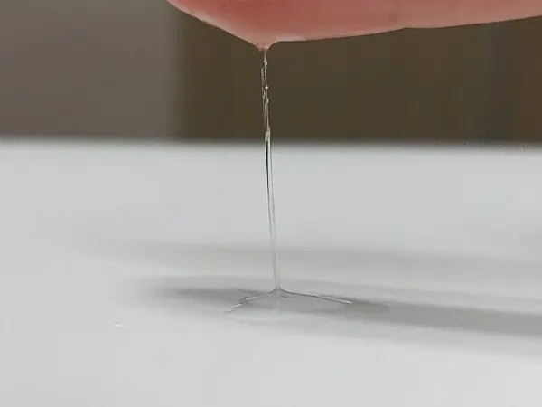 Showing the slippery, runny texture of Celladix Sebum Rebalancing Rx 131 Ampoule