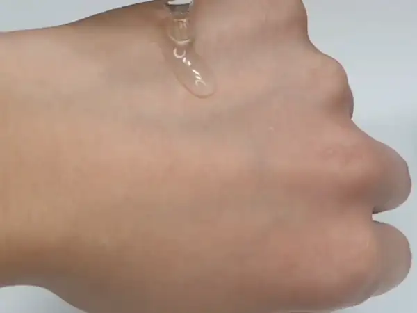 Showing Celladix Sebum Rebalancing Rx 131 Ampoule applied on the back of the hand