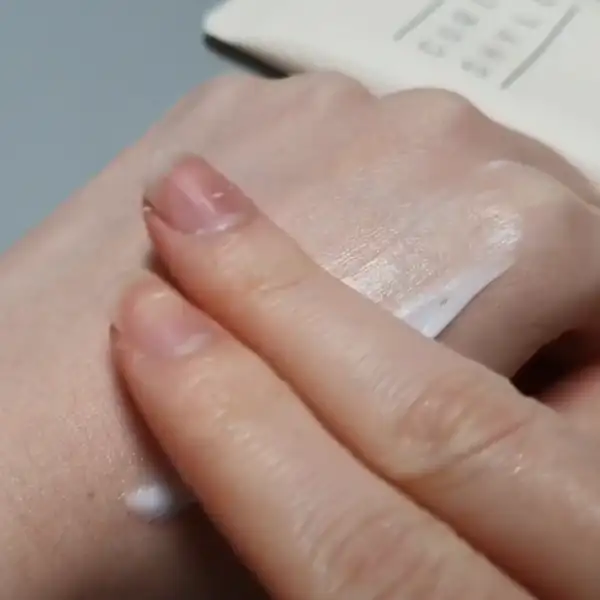 Testing the Curlyshyll Perfection Curl Cream texture on the back of the hand