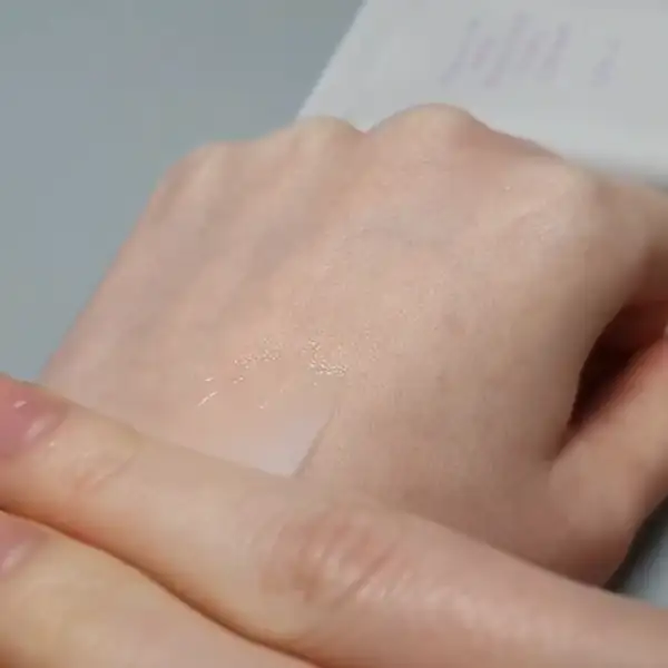 Testing the Lorinique Keratin Curl Cream texture on the back of the hand