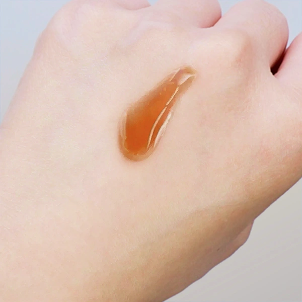 Runny texture of the Isntree Green Tea Serum tested on the back of the hand