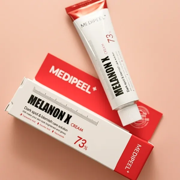 Overhead view of the Medipeel Melanon Cream product and its packaging